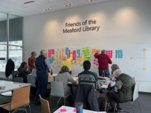 group of over 20 people from business, government, nonprofits, and philanthropy, across our region